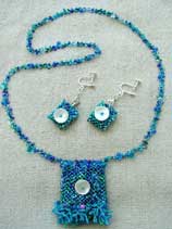 Lynn Davy beading, Mermaid’s Purse, a right-angle weave and peyote amulet bag.  Tiny shell sequins that decorate the front of this reversible amulet bag. The matching earrings are also reversible 