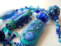 Lynn Davy Beading - Beading Gallery - Photography by Joanna Bury. Blue Bananas  A test version of my Beadwork magazine project ‘Going Bananas’; that one is very yellow, this one is very blue and features lampwork beads by Billie Jean Little. It’s like some sort of exotic sea creature! Currently listed for sale in my Etsy shop  click on thumbnail to see larger image 