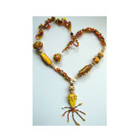 Lynn Davy Beading - Beading Gallery - Photography by Joanna Bury.  Going Bananas  Seed beads, bone, horn, beaded beads and crystals combine in a richly coloured citrus and chocolate setting for a fabulous (and very yellow) set of ‘Nemo’ lampworked glass beads by talented UK beadmaker Emma Ralph. Published in Beadwork magazine in June 2008   click on thumbnail to see larger image
