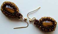 Lynn Davy Beading - Beading Gallery - Photography by Joanna Bury. Tigereye earrings  Silky smooth tigereye cabochons in tiny seed beaded bezel settings; a proposed new kit design for Westcoast Jewellery   click on thumbnail to see larger image 